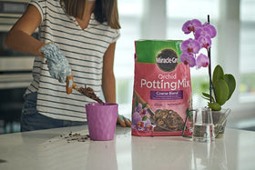 Miracle-Gro Orchid Potting Mix coarse fast-draining formula supports drier roots between waterings.