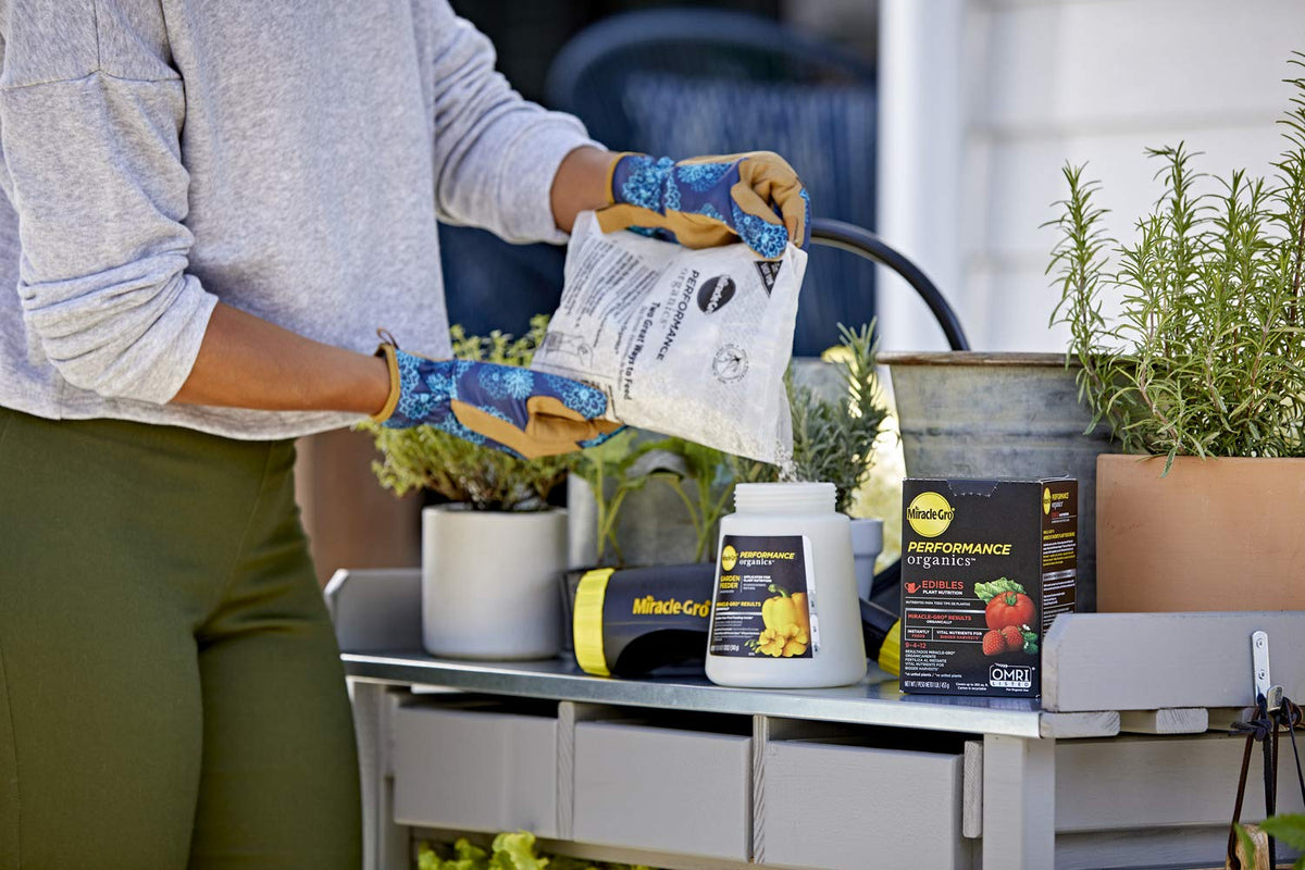 Miracle-Gro Performance Organics Edibles nourishing herbs in pots.