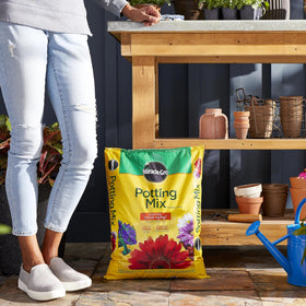 Miracle-Gro Potting Mix label feeds up to six months for steady nourishment