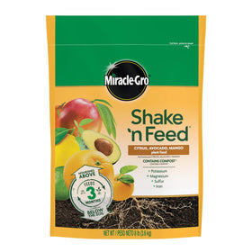 Miracle-Gro Shake 'n Feed bag label close-up shows nutrients for citrus, avocado, and mango trees.