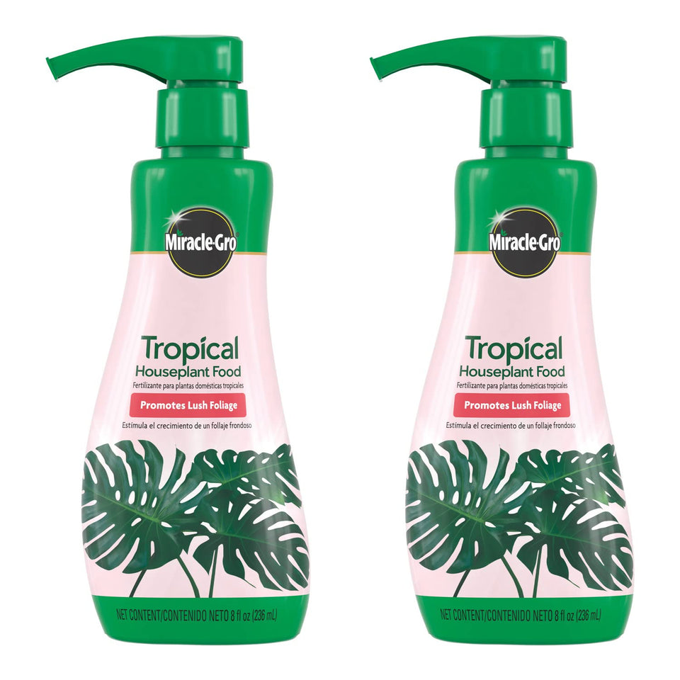 Miracle-Gro Tropical Houseplant Food bottle pour showing easy dosing for lush foliage