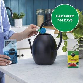 8-ounce Miracle-Gro container ready for regular plant feeding routines.