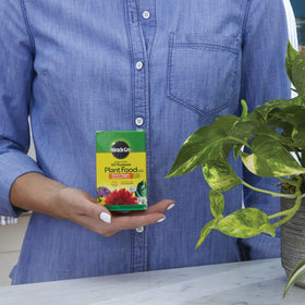 Miracle-Gro All Purpose Plant Food label packaging highlights universal formula.