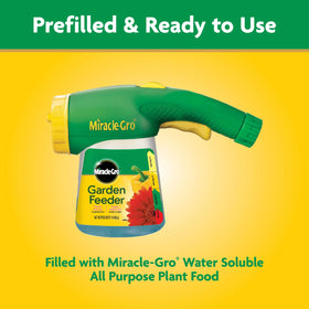 Miracle-Gro water-soluble plant food bottle ready with feeder.