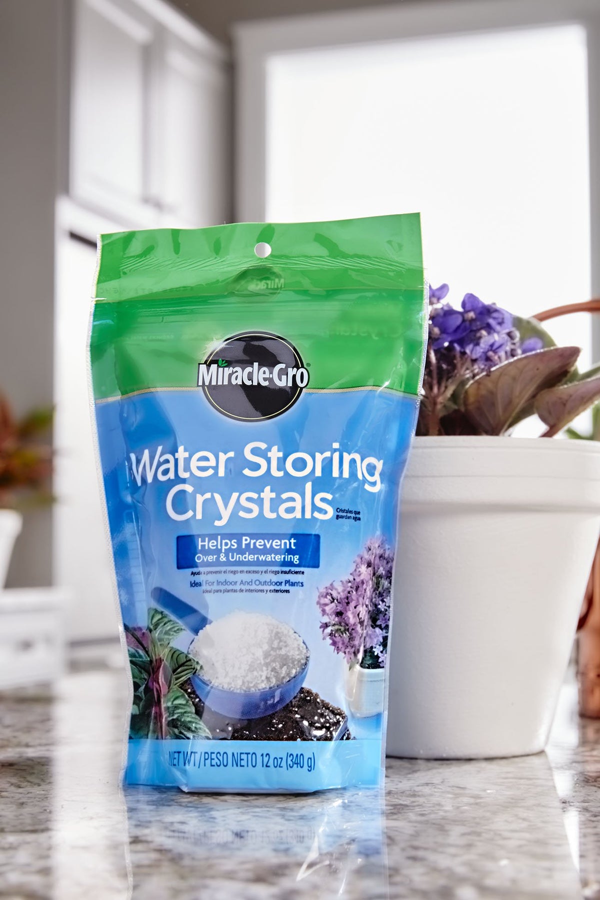 Miracle-Gro Water Storing Crystals mixed into soil in a pot to reduce watering.