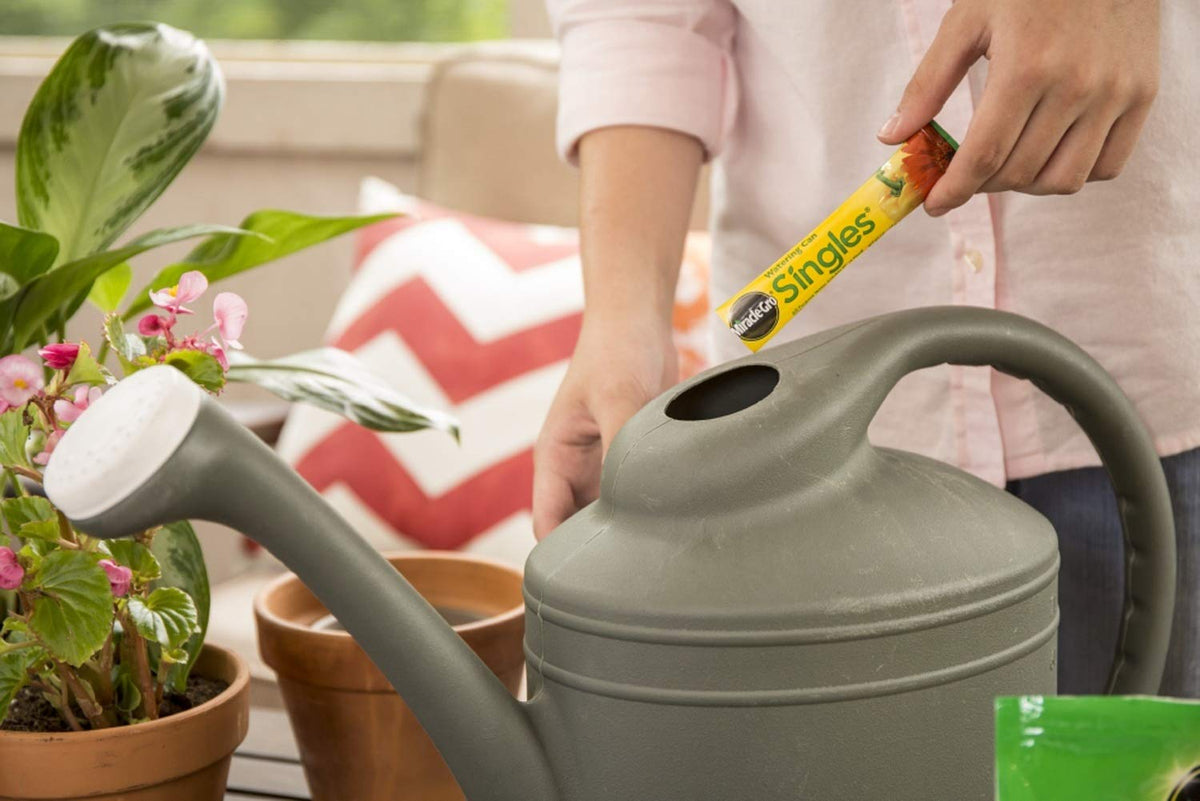 Miracle-Gro Watering Can Singles dissolving powder in water delivers nutrients fast