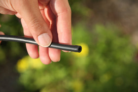 Mister Landscaper vinyl tubing close-up highlights thick, heavy-walled construction and UV resistance.