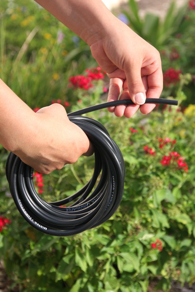 Mister Landscaper black 1/4in vinyl tubing in use for drip system extensions