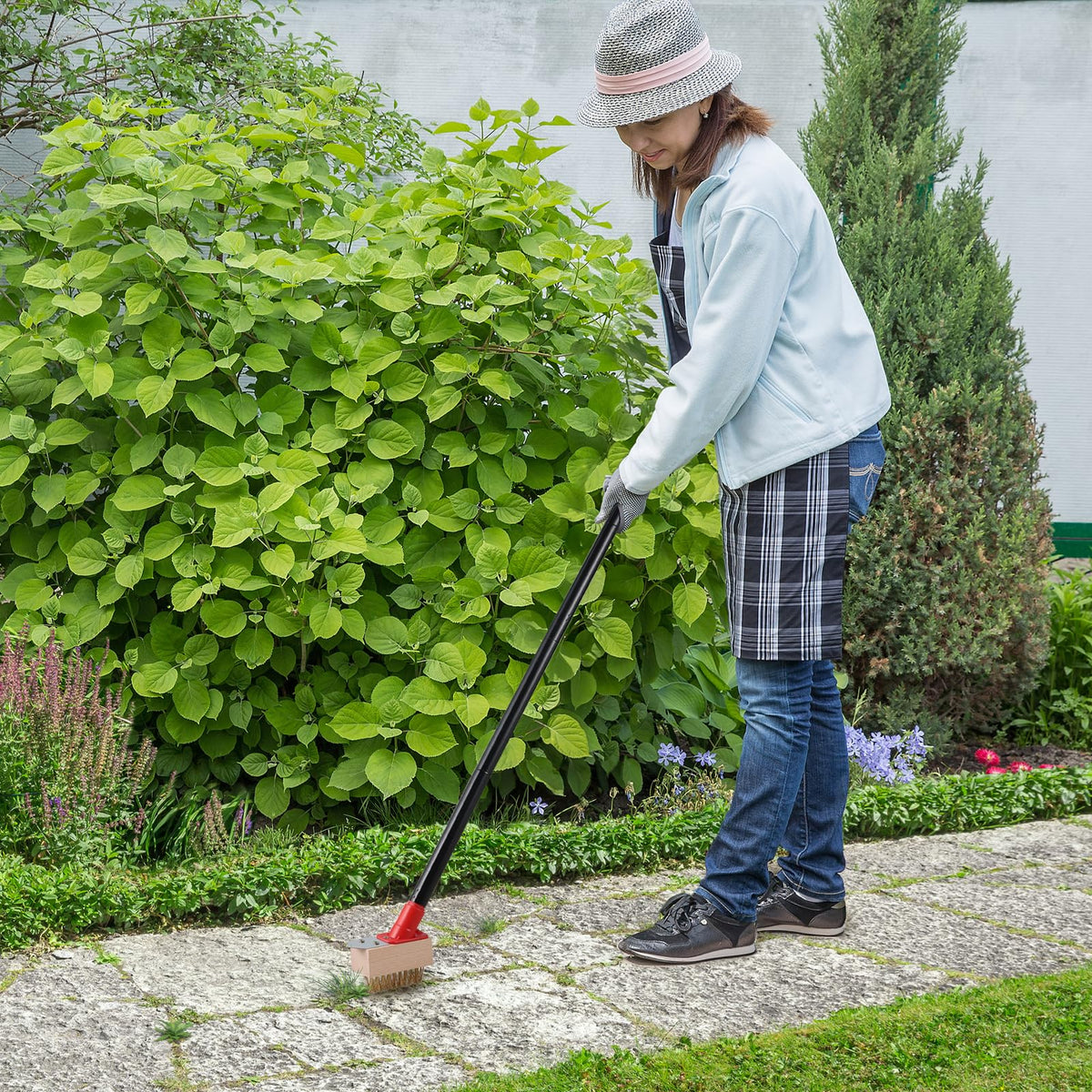 Mitclear weed remover with V-shaped wire brush cleaning deck crevices.