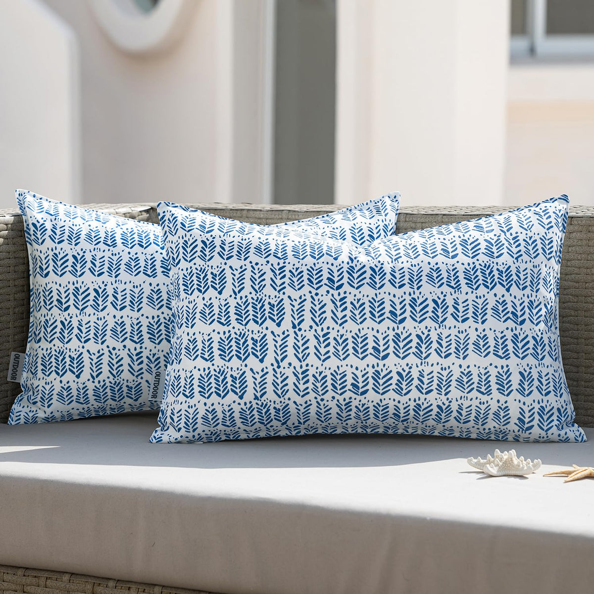 MIULEE outdoor lumbar pillow in royal blue on a patio sofa for comfortable seating.