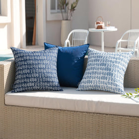 MIULEE outdoor pillow on a patio setup for versatile outdoor decor