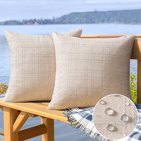 MIULEE beige outdoor pillow cover on patio furniture showcasing water resistance.