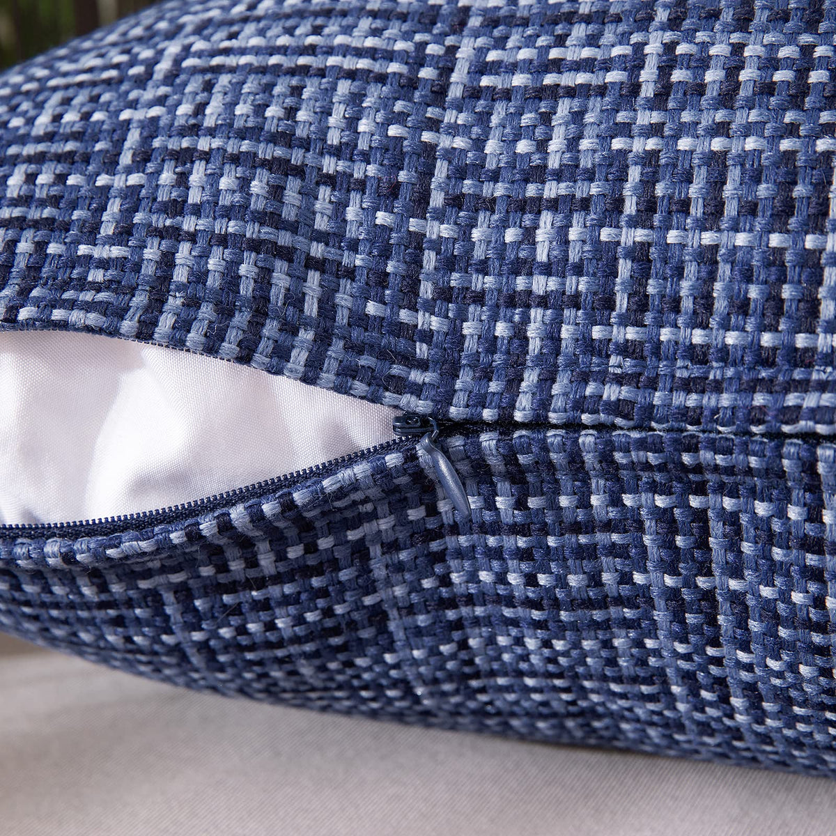 MIULEE navy pillow cover shown in a patio garden setup