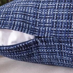 MIULEE navy pillow cover shown in a patio garden setup