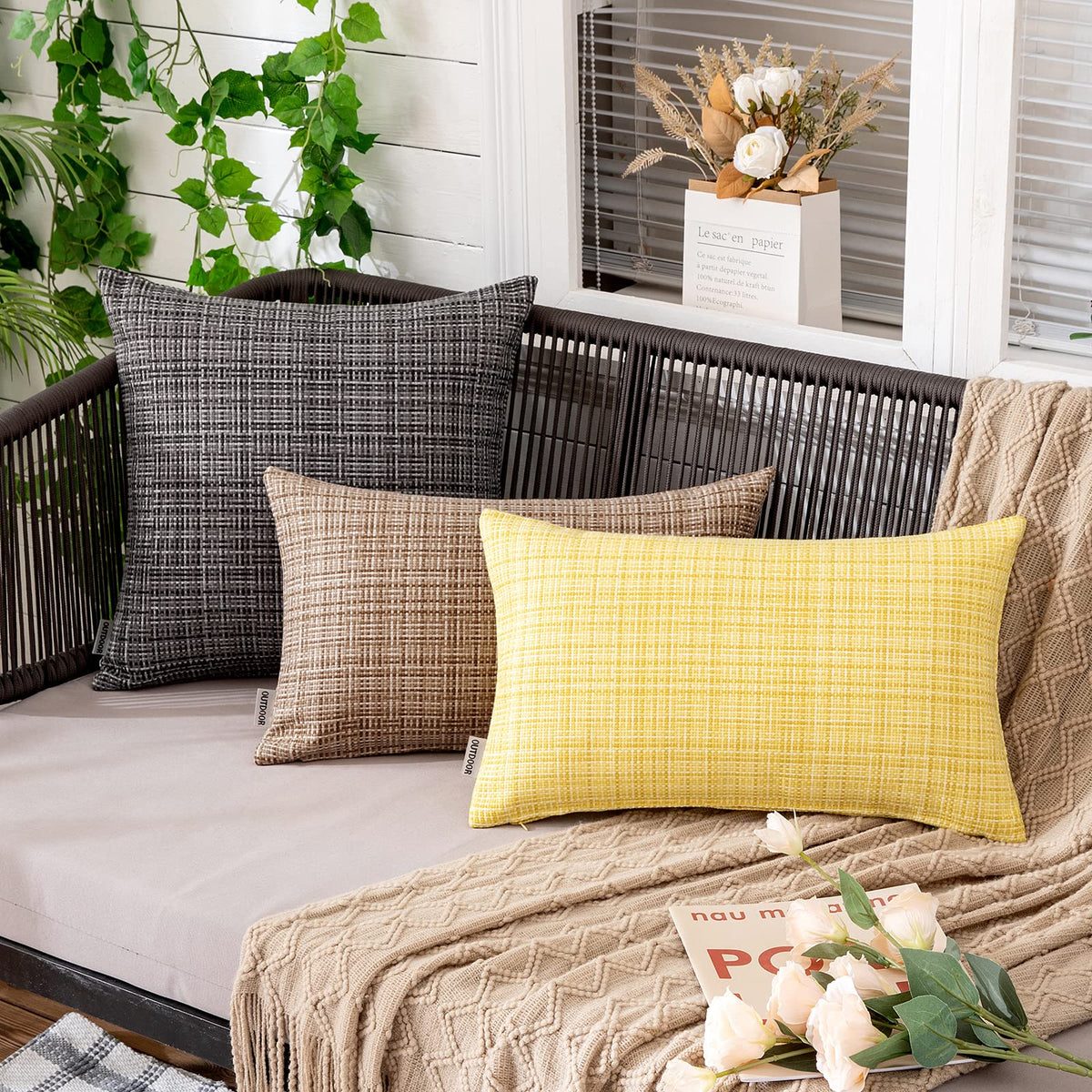 MIULEE pillow cover on a patio setup in yellow; easy to refresh decor.