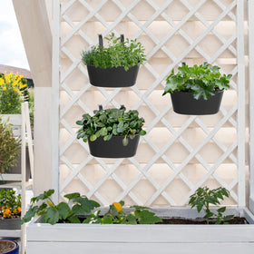 Mkono balcony planters hung on a fence demonstrate space-saving decor.