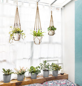 Mkono brown hanging planter complements rustic and natural interiors.