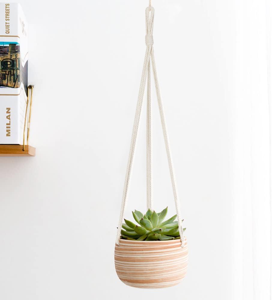 Mkono macrame cotton rope hanger enhances small-space displays.