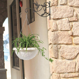 Mkono dark-finish hook blends with outdoor spaces while highlighting hanging decor.