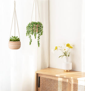 Mkono interior bare clay pot contrasts with unglazed exterior.