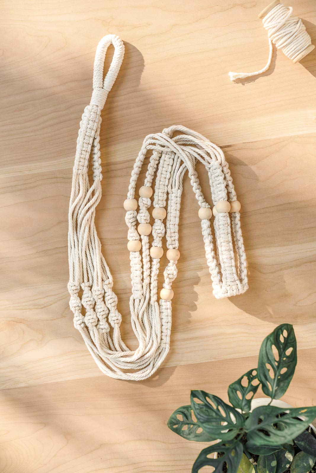 Mkono long reach helps suspend larger pots with ease in any room.