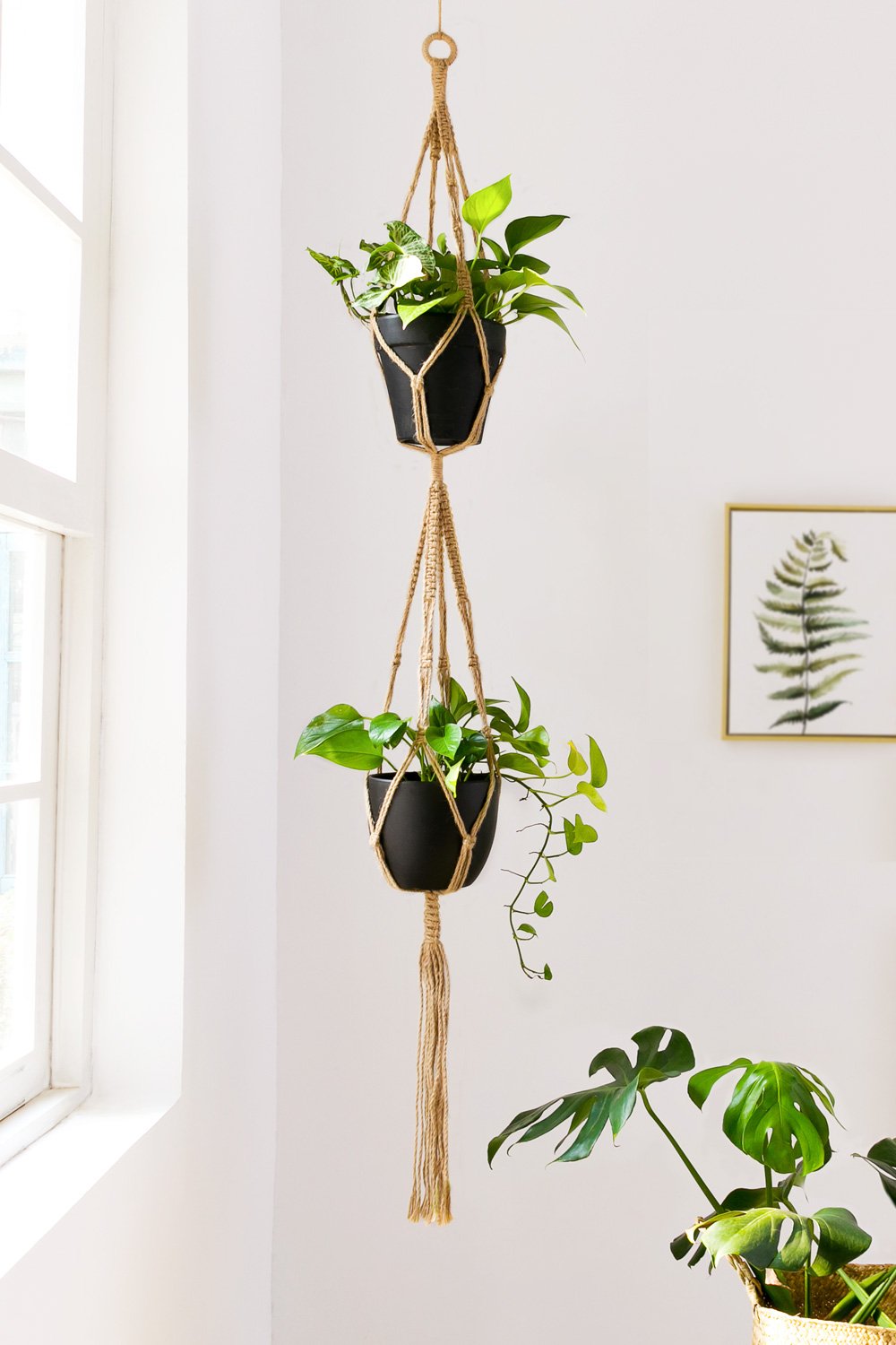 Mkono jute cord plant stand combines natural texture with modern style.