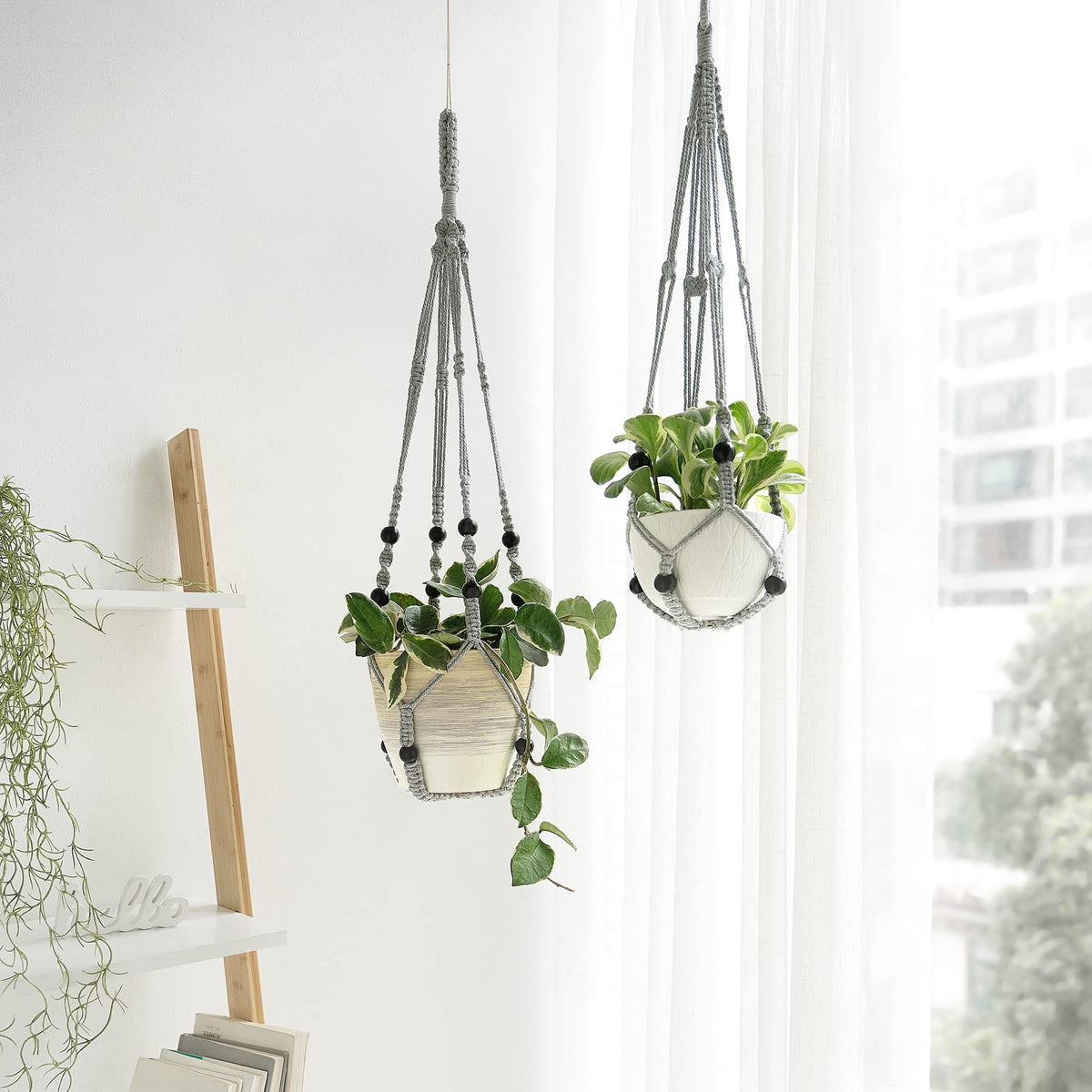 Mkono macrame plant hanger grey bead detail highlights handmade craftsmanship.