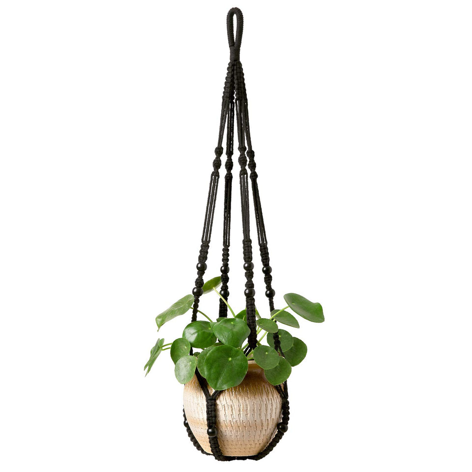 Mkono macrame plant hanger with wood beads for indoor decor and 9-inch pots.