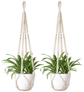 Mkono macrame plant hanger with wood beads holds a 9-inch pot for balcony decor.