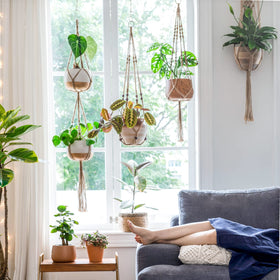 Mkono wall-hanging plant baskets enhance boho style on balcony or entryway.