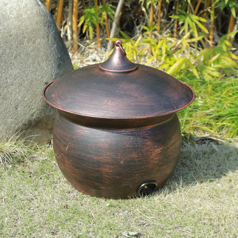 MNRYLKB metal garden hose storage pot with copper finish keeps hoses organized outdoors.