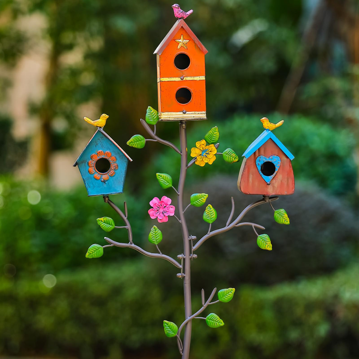 MOCOME colorful metal bird houses outdoors on stake for durable garden decor.