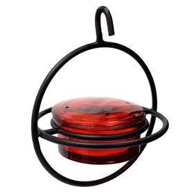 Monarch Abode hanging hummingbird feeder with glass bowl enhances garden décor and feeding.