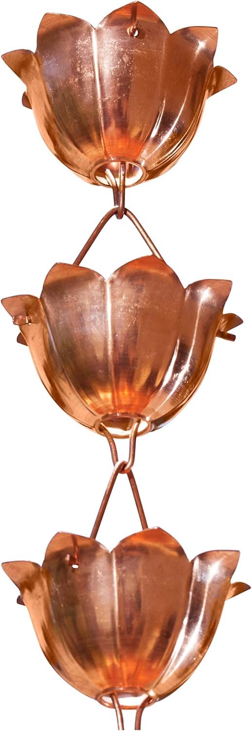 Monarch Rain Chains pure copper lotus cups guiding rainfall for stylish gutter drainage.