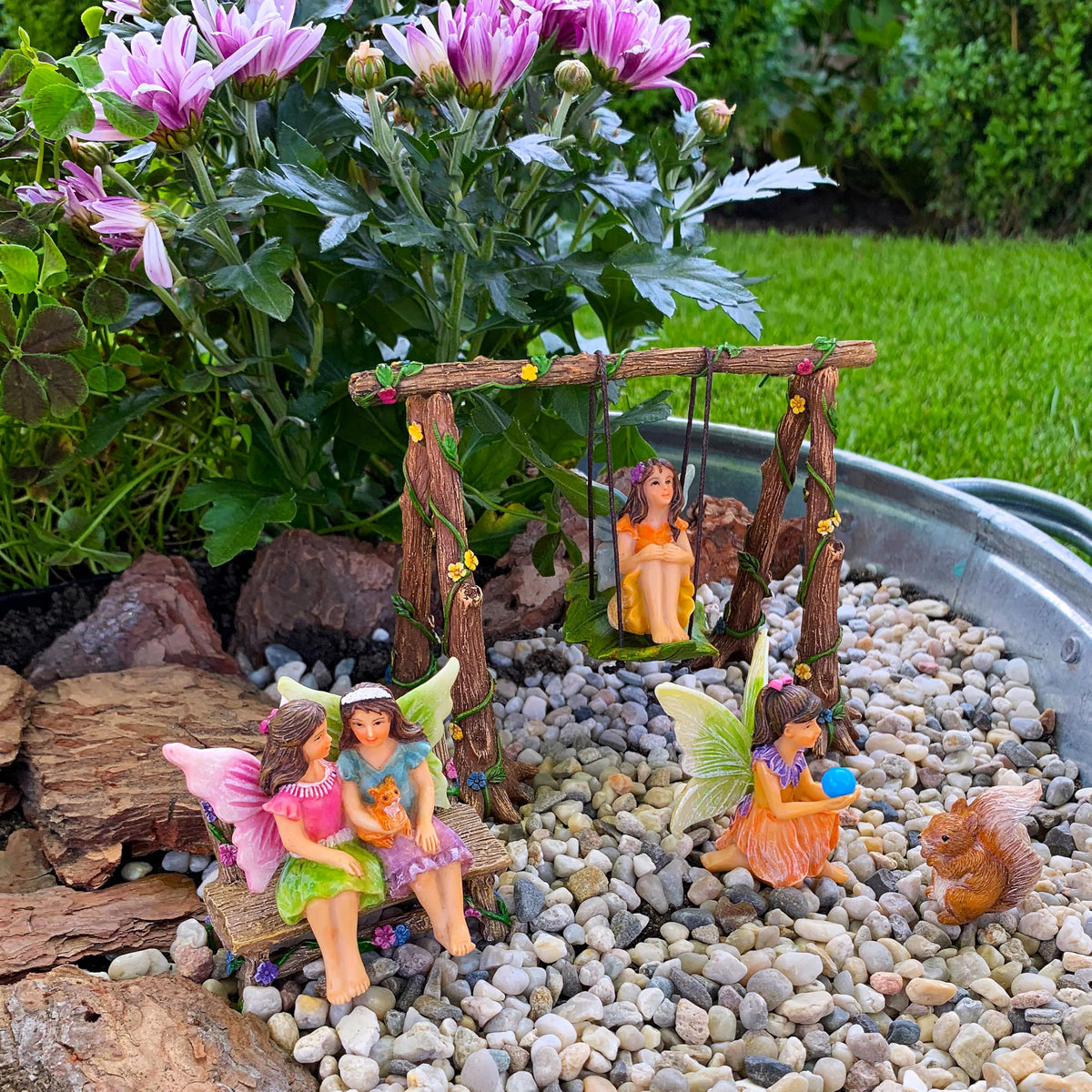 Mood Lab fairy swing pieces enhance themed garden displays.