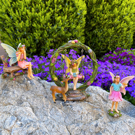 Mood Lab Fairy Garden Swing figures complement display setups, from petals to stones.