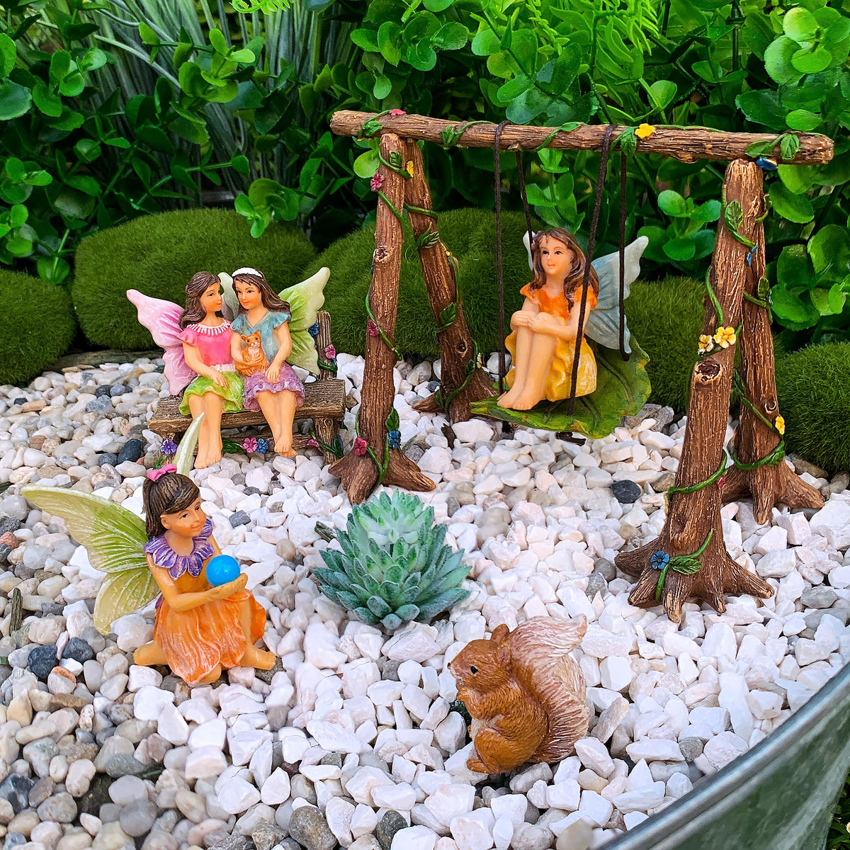 Mood Lab resin fairies with swing withstand sun and rain outdoors.