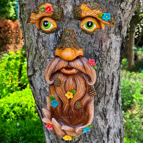 Mood Lab Tree Face Decor: old man face with flowers brightens garden.