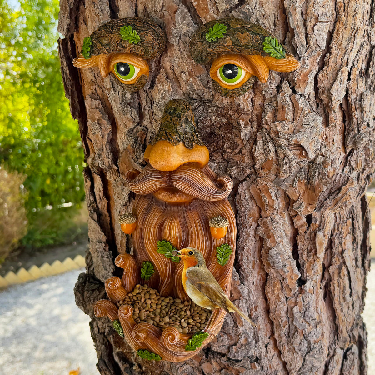 Mood Lab Resin Tree Face is hand painted for a vivid garden accent