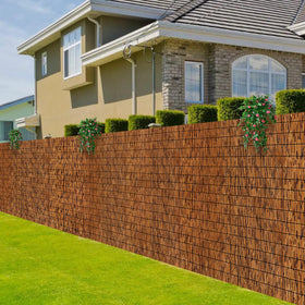 MOOKNAT natural reed fence brown panel provides privacy for outdoor spaces.