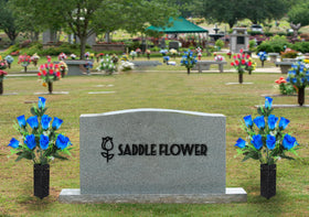 MOOMASS cemetery vase being inserted into ground for quick grave installation