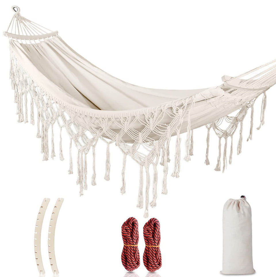 MOSFiATA backyard hammock with tassels in white canvas for stylish outdoor lounging.