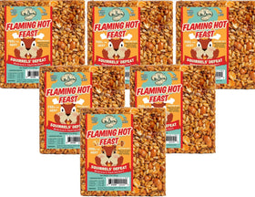 Mr. Bird Flaming Hot Feast seed cake mounted on a cylinder feeder attracts diverse birds.