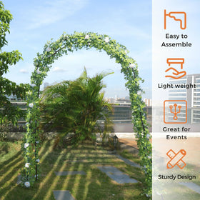 Mr.Ton garden arch beside a raised bed adds vertical interest.