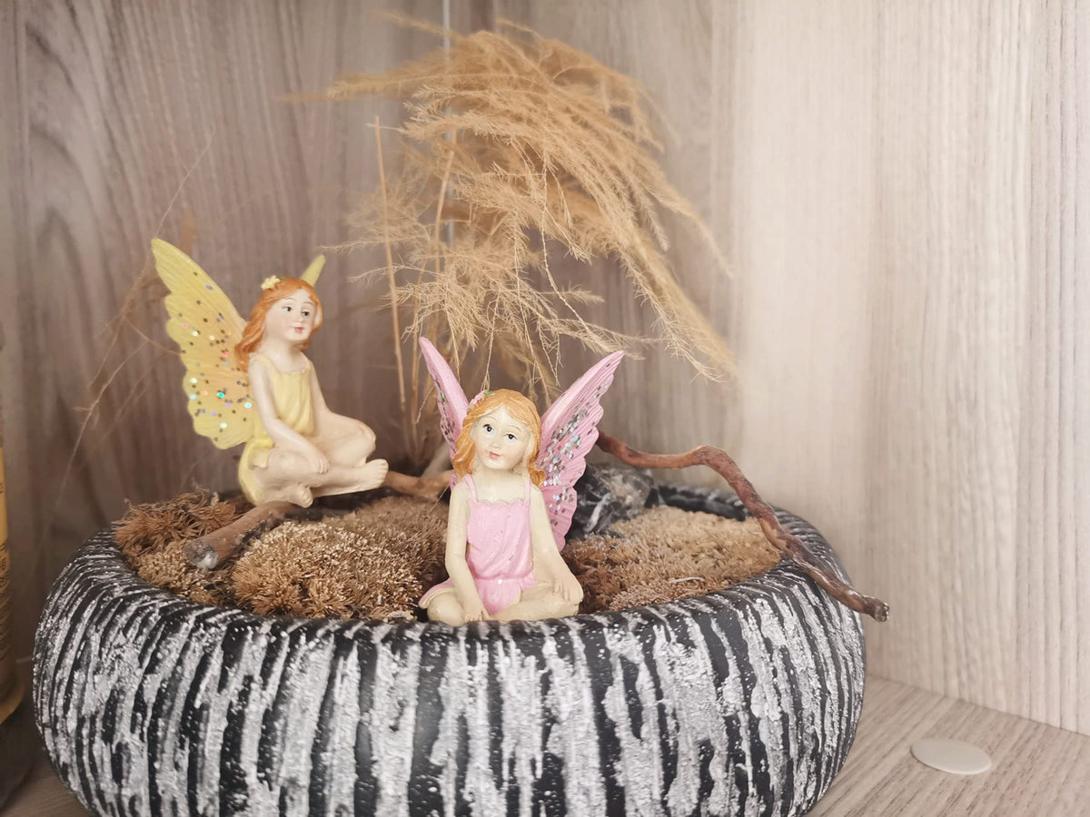 MUAMAX dressed fairy statue designed so it won’t disappear under foliage.