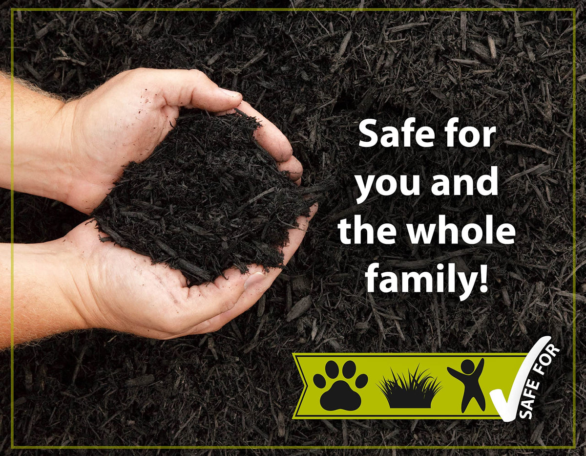 Mulch Worx black color concentrate spray in action on mulch.