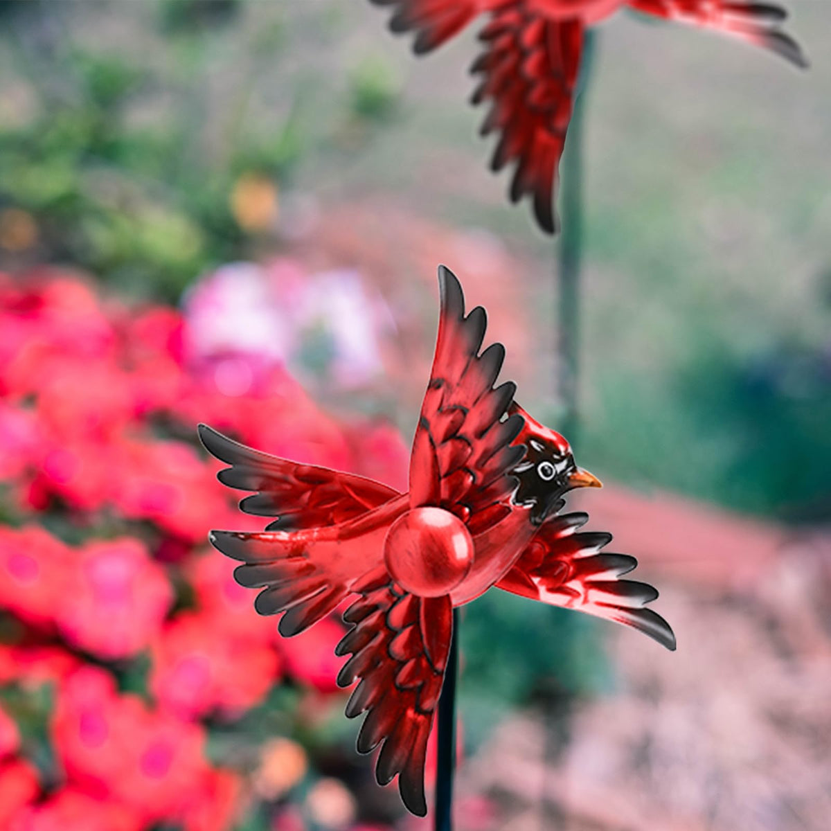 MUMTOP Cardinal Wind Spinner in wind creates hypnotic movement along garden paths.