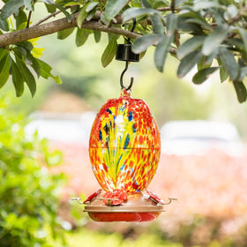 Muse Garden hanging feeder outdoors, showcasing decorative garden focal point and bird attraction.