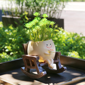 MUZZIOU rocking-chair planter smile adds whimsy to indoor or outdoor spaces.