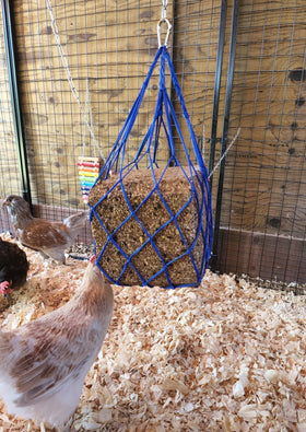 Muzzys 25-lb seed block holder keeps large blocks accessible for flock.